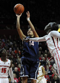 UConn Huskies guard Bria Hartley shoots for two of her 12 first-half points over Rutgers Scarlet Knights guard Kahleah Copper in the first half at the Rutgers Athletic Center Sunday.
