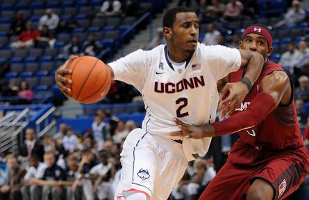 Connecticut Huskies forward DeAndre Daniels (2) drives around Temple Owls forward Anthony Lee (3) during the first half at the XL Center in Hartford, Conn., on Tuesday, Jan. 21, 2014.