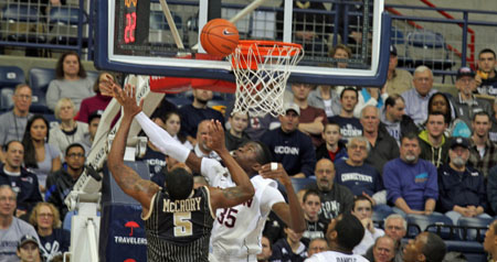 Amida Brimah with one of his five blocked shots.