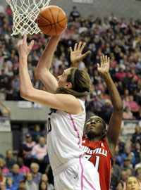  UConn Huskies forward Breanna Stewart shoots over Louisville Cardinals forward Asia Taylor in the second half at Gampel Pavilion Sunday. 