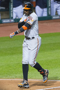  Adam Jones #10 of the Baltimore Orioles celebrates after hitting a solo home run during the fourth inning against the Cleveland Indians at Progressive Field on September 4, 2013 in Cleveland, Ohio. 