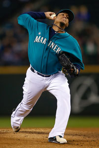  Starting pitcher Felix Hernandez #34 of the Seattle Mariners pitches against the Oakland Athletics at Safeco Field on September 27, 2013 in Seattle, Washington. 