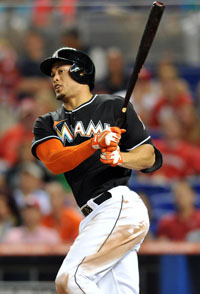  Giancarlo Stanton #27 of the Miami Marlins connects for a double during the seventh inning against the St. Louis Cardinals at Marlins Park on June 14, 2013 in Miami, Florida. 
