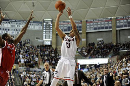  Connecticut Huskies guard Shabazz Napier (13) takes a shot over Rutgers Scarlet Knights' Malick Kone during the first half at Gampel Pavilion in Storrs, Conn., on Wednesday, March 5, 2014. 