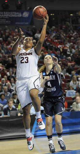  UConn forward Kaleena Mosqueda-Lewis goes for a layup ahead of Brigham Young guard Kim Beeston in the first half. 