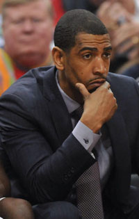  UConn coach Kevin Ollie looks distraught during the second half of his team's 81-48 loss to Louisville at the KFC Yum! Center Saturday afternoon. 