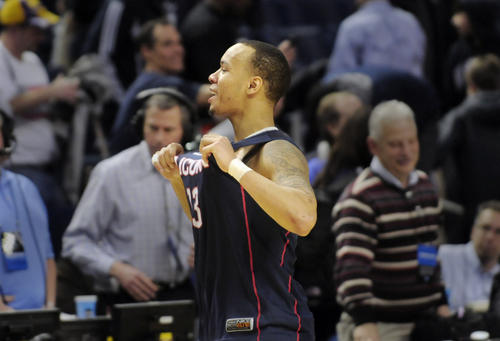  UConn's Shabazz Napier, the star of the show with 25 points, yells to the crowd at the end.