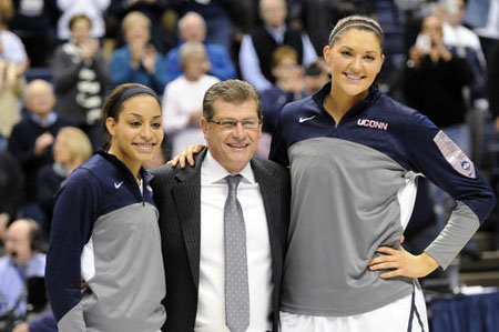 UConn coach Geno Auriemma poses for a photo with his two seniors, guard Bria Hartley and center Stefanie Dolson at Gampel Pavilion Saturday after the two were honored at Senior Day ceremonies before their last home game of the regular season against Rutgers. 