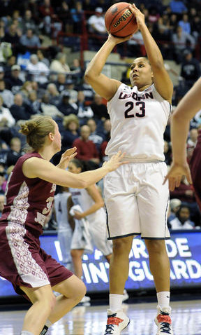 UConn Huskies forward Kaleena Mosqueda-Lewis (23) shoots for two of her 20 points over St. Joseph's (PA) Hawks forward Kelsey Berger (34) in the second half of their second-round game against St. Joseph's in the the NCAA Tournament at Gampel Pavilion Tuesday.