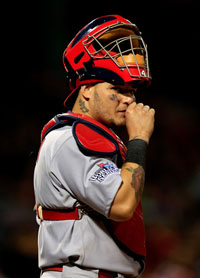  Yadier Molina #4 of the St. Louis Cardinals looks on against the Boston Red Sox during Game Six of the 2013 World Series at Fenway Park on October 30, 2013 in Boston, Massachusetts. 