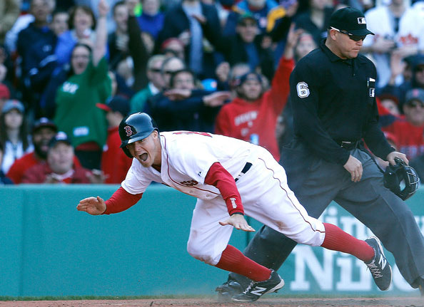  Brock Holt #26 of the Boston Red Sox reacts after he scored on a suicide squeeze against the Baltimore Orioles in the seventh inning at Fenway Park on April 19, 2014 in Boston, Massachusetts. 