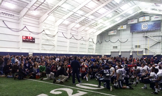 UConn Huskies football coach Bob Diaco address his team as well as UConn students during the "Dog House Pizza Party" at the end of practce on Wednesday night.