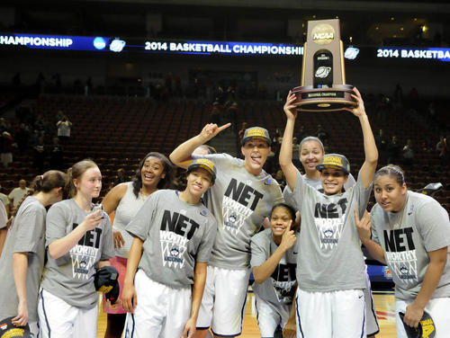  The UConn women's basketball team hams it up with the NCAA Lincoln Regional championship trophy after defeating Texas A&M, 69-54. 