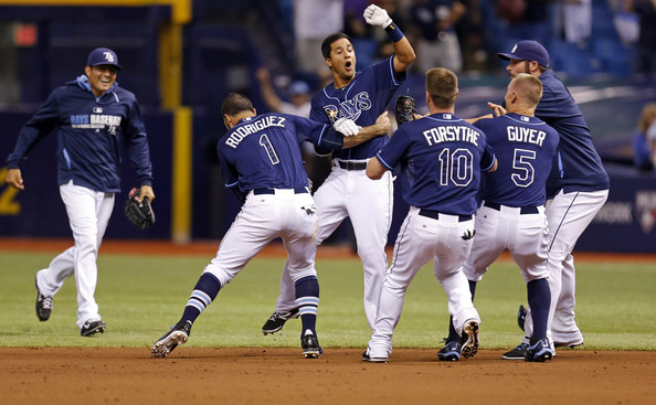  Cole Figueroa #35 of the Tampa Bay Rays (C) is congratulated by teammates after hitting a walk-off RBI double in the ninth inning of a baseball game against the Boston Red Sox at Tropicana Field on May 23, 2014 in St. Petersburg, Florida. 