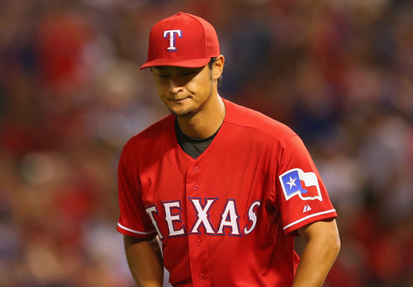  Yu Darvish #11 of the Texas Rangers reacts after Alex Rios commited an error on a fly by David Ortiz #34 of the Boston Red Sox in the 7th inning at Globe Life Park in Arlington on May 9, 2014 in Arlington, Texas. 