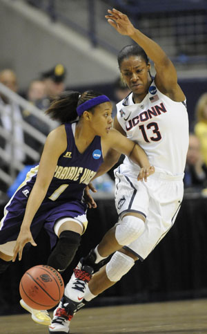 Prairie View guard Jeanette Jackson drives around the defense of UConn guard Brianna Banks.