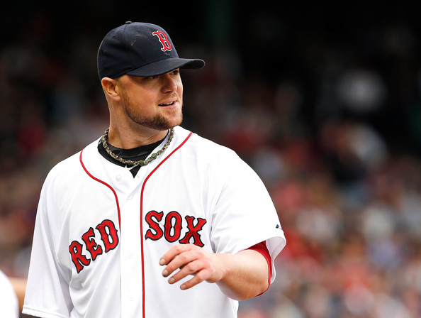  Jon Lester #31 of the Boston Red Sox smiles after he made an assist on a ball hit back to the mound by Coco Crisp #4 of the Oakland Athletics in the sixth inning at Fenway Park on May 3, 2014 in Boston, Massachusetts. 