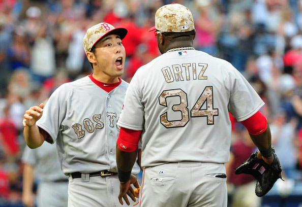  Koji Uehara #19 of the Boston Red Sox celebrates with David Ortiz #34 after the game against the Atlanta Braves at Turner Field on May 26, 2014 in Atlanta, Georgia. 