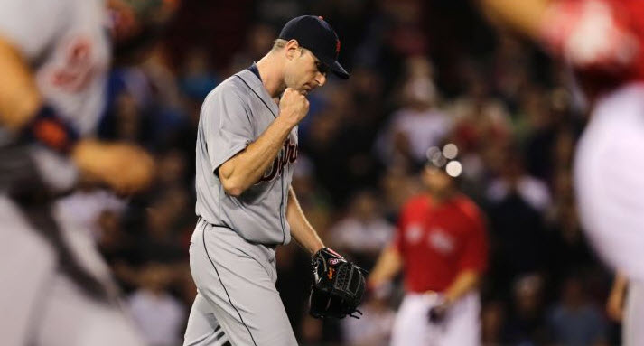 Detroit Tigers starting pitcher Max Scherzer pumps his fist after getting Boston Red Sox's Grady Sizemore to ground into a double play during the sixth inning of a baseball game at Fenway Park in Boston, Friday, May 16, 2014. 