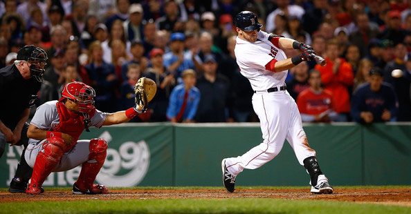  Will Middlebrooks #16 of the Boston Red Sox hits a go-ahead RBI single in the 8th inning against the Cincinatti Reds during the interleague game at Fenway Park on May 7, 2014 in Boston, Massachusetts. 
