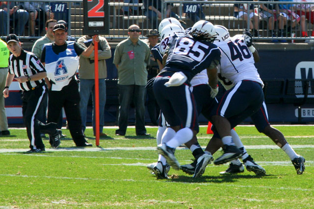 Marquise Vann (46) tries to help his teammates make tackle during the 2014 UConn Football spring game at Rentschler Field.