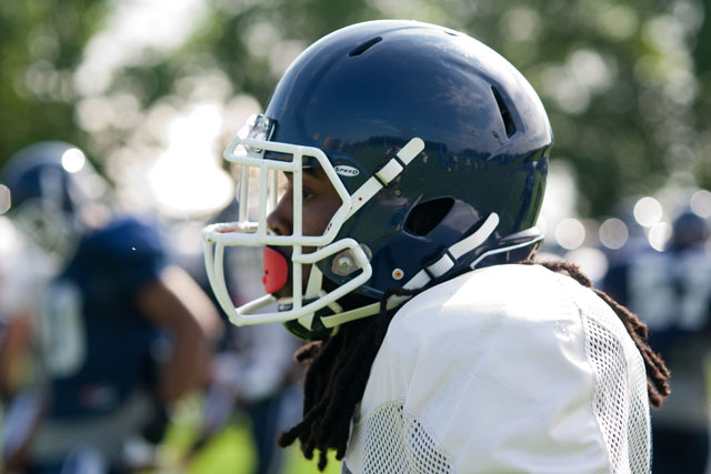 UConn WR Geremy Davis looks on during the stretching drills at practice on Wednesday, August 6, 2014.