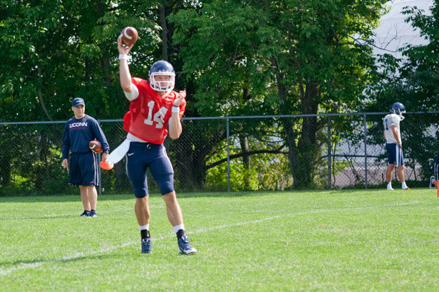 UConn QB Tim Boyle (14) throws a pass during practice.
