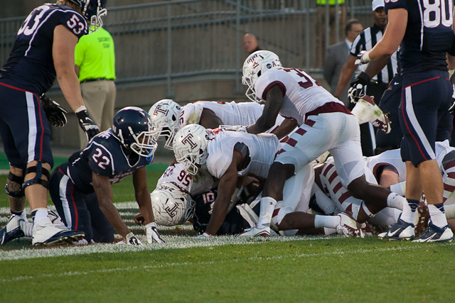 UConn QB #10 Chandler Whitmer is sacked by Temple's Tyler Matakevich and Nate Smith for a safety in the third quarter on Saturday, September 27, 2014 at Rentschler Field in East Hartford, CT.