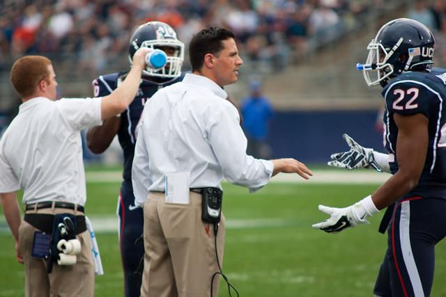 UConn head coach Bob Diaco talks with #22 Andrew Adams during at timeout against Boise State at Rentschler Field on September 13, 2014.