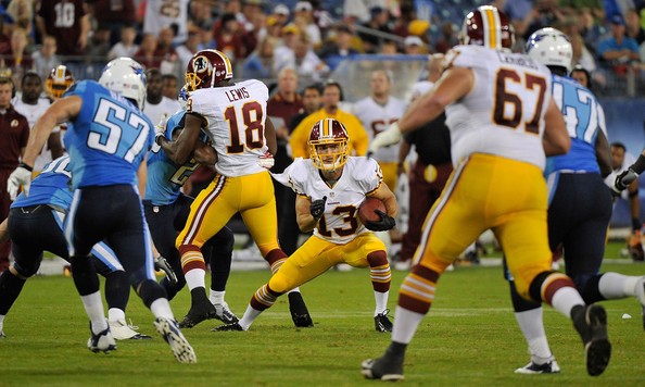  Nick Williams #13 of the Washington Redskins makes a reception against the Tennessee Titans during a pre-season game at LP Field on August 8, 2013 in Nashville, Tennessee. 