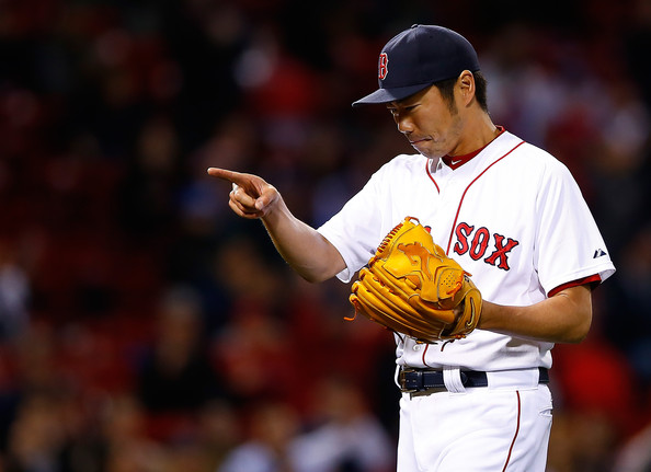  Koji Uehara #19 of the Boston Red Sox celebrates following his save in the 9th inning against the Tampa Bay Rays during the game at Fenway Park on September 25, 2014 in Boston, Massachusetts. 