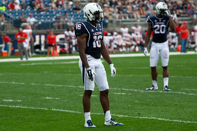#16 Byron Jones looks over to the UConn sideline for a play call against the Stony Brook Seawolves at Rentschler Field on September 6, 2013.