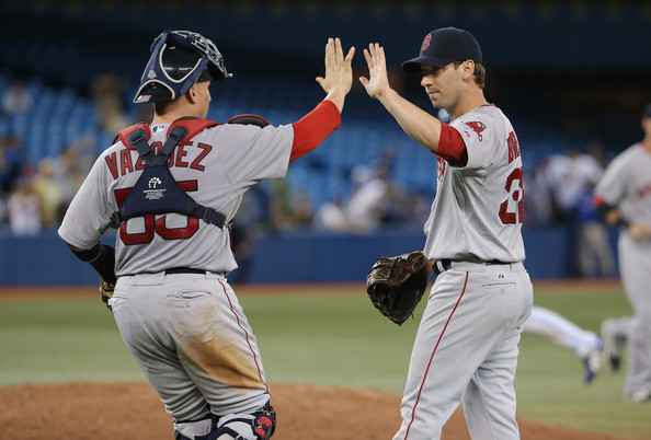  Craig Breslow #32 of the Boston Red Sox celebrates their victory with Christian Vazquez #55 during MLB game action against the Toronto Blue Jays on August 25, 2014 at Rogers Centre in Toronto, Ontario, Canada. 