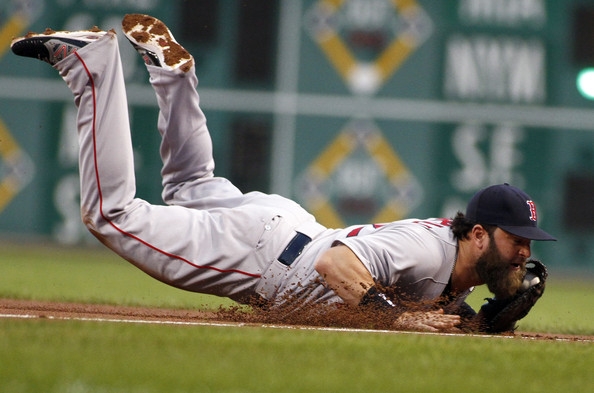  Mike Napoli #12 of the Boston Red Sox makes diving catch in the first inning against the Pittsburgh Pirates during inter-league play at PNC Park on September 16, 2014 in Pittsburgh, Pennsylvania. 
