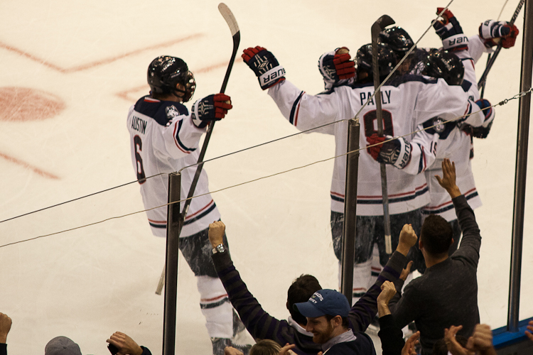 The UConn Huskies Men's Hockey team celebrates after Evan Richardson's goal in the first period against the BC Eagles at the XL Center in Hartford, CT on November 5, 2014.