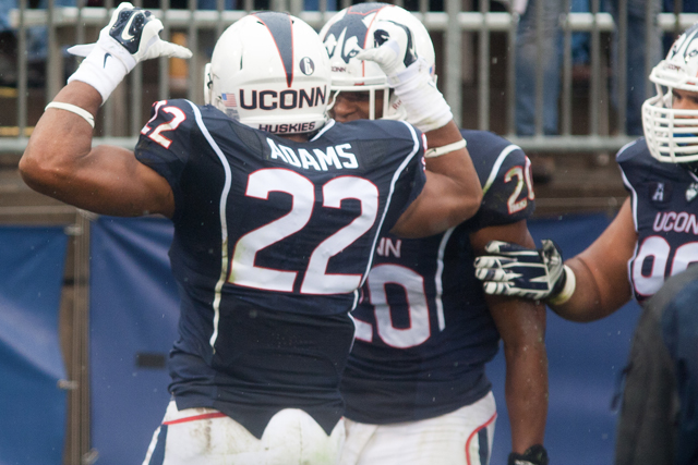 UConn S #22 Andrew Adams celebrates his first interception against the UCF Knights at Rentschler Field on November 1, 2014. Adams finished the game with three interceptions.