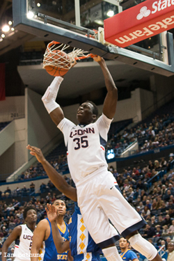 UConn C Amida Brimah slams home two points in the first half against Coppin State at the XL Center on December 14, 2014.