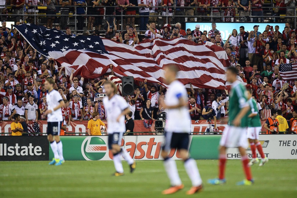 COLUMBUS, OH - SEPTEMBER 10: Fans unfurl a large U.S. flag after the U.S. Men's National Team scored their second goal against Mexico in the second half at Columbus Crew Stadium on September 10, 2013 in Columbus, Ohio. The United States defeated Mexico 2-0. (Photo by Jamie Sabau/Getty Images)