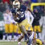 NASHVILLE, TN - DECEMBER 30:  Tarean Folston #25 of the Notre Dame Fighting Irish runs with the ball on the game winning drive in the fourth quarter against the LSU Tigers in the Franklin American Mortgage Music City Bowl at LP Field on December 30, 2014 in Nashville, Tennessee.  (Photo by Andy Lyons/Getty Images)