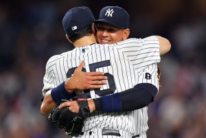 NEW YORK, NY - AUGUST 12: Alex Rodriguez #13 of the New York Yankees gets a hug from team mate Mark Teixeira #25 in the ninth inning against the Tampa Bay Rays at Yankee Stadium on August 12, 2016 in New York City. (Photo by Drew Hallowell/Getty Images)